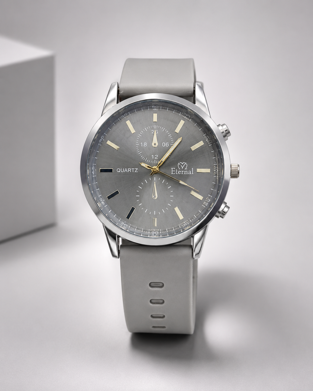 Men’s premium grey chronograph watch with silicone strap on green grass.