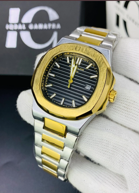 A two-tone stainless steel and gold watch with a black ribbed dial, held on a white gloved hand.